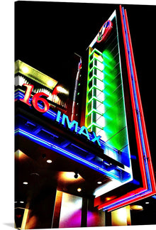  This stunning photograph of a neon sign for an IMAX movie theater at night is a must-have for any fan of cinema, neon lights, or simply beautiful photography. The neon sign glows brightly in the darkness, and its vibrant colors create a sense of excitement and anticipation. The surrounding buildings are blurred, which further highlights the sign and makes it the focal point of the photograph.
