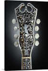 Immerse yourself in the intricate beauty of this exclusive artwork. This print captures the ornate headstock of a classic guitar, meticulously crafted with every curve, detail, and pattern showcasing an elegant dance between artistry and craftsmanship. The dark backdrop accentuates the white filigree design adorned with a cherub amidst floral elegance.