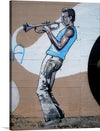 “Graffiti en Ormaiztegi” is a captivating print that brings the vibrant energy of street art into your space. The artwork features a musician engrossed in the harmonious melodies of a trumpet, captured in a dynamic graffiti style. 