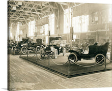  “French Automobile section in the Palace of Transportation at the 1904 World’s Fair” is a captivating print that captures the elegance and innovation of the French Automobile section at the 1904 World’s Fair. The artwork features each vehicle, a masterpiece of early 20th-century design, displayed with grandeur amidst the architectural splendor of the Palace of Transportation. 