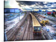  “Berlin Calling HDR” is a stunning print that captures the essence of the city. The image showcases the industrial side of Berlin with a train passing through the city. 