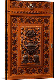  This beautiful print of an ornate wooden door is a perfect addition to any home. The intricate details and warm colors will add a touch of sophistication and elegance to any room. The print is a photo-realistic image of an ornate wooden door with a warm orange-brown color. 