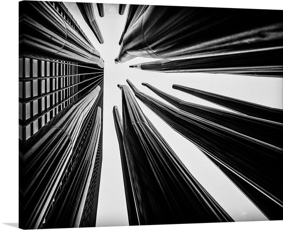 This captivating artwork print captures the awe-inspiring majesty of towering structures, converging into the heavens in a symphony of architectural brilliance. The black and white palette accentuates the intricate details and shadows, evoking a sense of mystery and grandeur. Each line and curve tells a story of human ingenuity, making this print an exquisite addition to any space seeking to inspire and mesmerize.