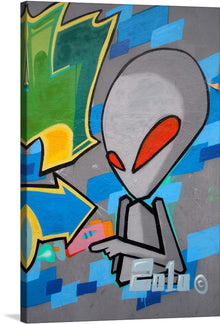  Dive into a world where the whimsical meets the enigmatic with this vibrant print of street art. The artwork features an iconic alien figure, rendered with sleek lines and bold colors, set against a dynamic backdrop of abstract shapes and graffiti elements. Every glance reveals another layer of detail, making this piece a constantly evolving exploration of form and color. 