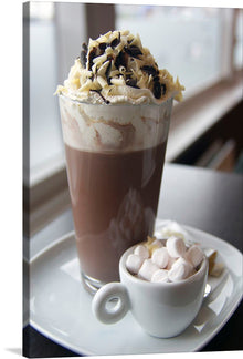  This print is a beautiful and mouth-watering image of a chocolate drink with whipped cream and chocolate shavings on top. It is perfect for any chocolate lover or anyone who appreciates the art of a well-crafted drink. 