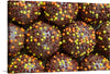 This print of “Sweets, Chocolate balls with sprinkles” is a delightful and colorful addition to any room. The image is a close up of chocolate balls covered in rainbow sprinkles, making it a playful and fun piece of art. This print would be perfect for a kitchen or dining area, or any space that could use a pop of color and sweetness.