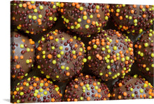  This print of “Sweets, Chocolate balls with sprinkles” is a delightful and colorful addition to any room. The image is a close up of chocolate balls covered in rainbow sprinkles, making it a playful and fun piece of art. This print would be perfect for a kitchen or dining area, or any space that could use a pop of color and sweetness.