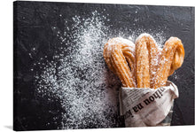  Dive into the world of “Sugar Coated Churros,” a captivating artwork that captures the essence of indulgence and sweetness. Each print brings to life the golden, crispy churros generously dusted with fine white sugar, evoking the irresistible allure of this classic treat. The contrast of the dark, textured background accentuates the warmth and inviting nature of these delightful pastries. 