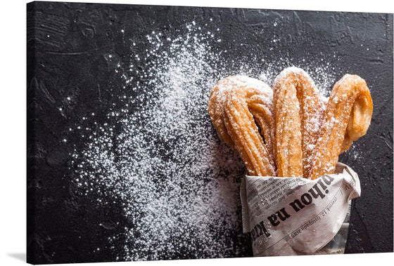 Dive into the world of “Sugar Coated Churros,” a captivating artwork that captures the essence of indulgence and sweetness. Each print brings to life the golden, crispy churros generously dusted with fine white sugar, evoking the irresistible allure of this classic treat. The contrast of the dark, textured background accentuates the warmth and inviting nature of these delightful pastries. 
