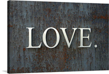  Introducing “LOVE,” a captivating artwork that marries the raw emotion of affection with the untethered beauty of natural elements. Each print captures the stark contrast between the bold, white lettering and the richly textured, oxidized metal backdrop.