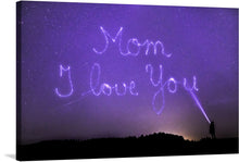  Illuminate your space with the tender and heartwarming message of this exquisite artwork. Captured against a backdrop of a star-studded night sky, the words “Mom, I Love You” are etched in radiant light, embodying an ethereal and celestial beauty. The silhouette of a lone figure accentuates the intimate and personal sentiment expressed in this piece. 