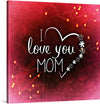 This exquisite artwork print, titled “I Love You Mom,” is a symphony of warm, radiant hues of red and sparkling lights. The heart shape, delicately outlined in white, encases the central message written in elegant white script. Decorative flowers scattered around the text add a touch of grace, enhancing its aesthetic appeal. 