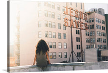  “Jesus Saves” is a captivating piece of artwork that seamlessly blends the urban landscape with a message of hope and salvation. The print captures a serene moment where an individual, immersed in contemplation, overlooks the iconic “Jesus Saves” sign perched atop a classic architectural building.