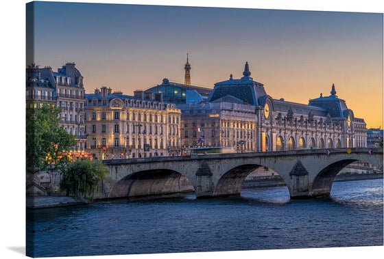 Immerse yourself in the enchanting allure of Paris with this exquisite print. The artwork captures a serene evening by the Seine, where the iconic Musée d’Orsay stands majestically against a twilight sky. Every detail, from the gentle ripples of the river to the grandeur of Parisian architecture, is rendered with stunning clarity and color. 