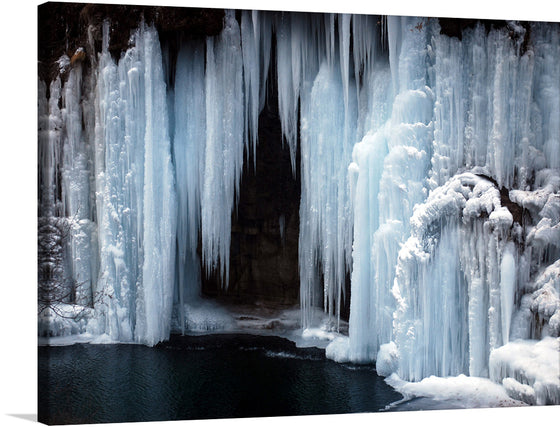 Immerse yourself in the serene beauty of “Frozen Waterfall,” a captivating print that brings the tranquil yet awe-inspiring essence of winter into your space. Each icicle is captured with exquisite detail, reflecting light and shadow to create a dynamic visual experience. 