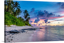  Immerse yourself in the serene beauty encapsulated in this exquisite print artwork. A tranquil beach, where the gentle waves of a crystal-clear ocean kiss the pristine shores, is bordered by lush greenery and towering palm trees. The sky, painted with hues of pink, purple, and blue during the magical moments of dusk, adds an ethereal touch to this natural paradise.