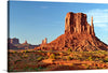 Immerse yourself in the serene beauty of this exquisite artwork, capturing the iconic landscape of towering rock formations set against a backdrop of clear skies and vibrant hues. Each print brings to life the natural majesty, offering a glimpse into a world where earth and sky converge in a dance of colors. The intricate play of light and shadow accentuates the rugged textures, evoking a sense of timeless elegance. 