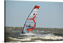  “Windsurf” captures the exhilarating dance between man and nature—a windsurfer navigating the tumultuous waves with grace and agility. The vibrant sail, a fiery orange against the azure sea, propels the surfer forward. Each splash of ocean mist, every curve of the board, tells a story of freedom and adventure.