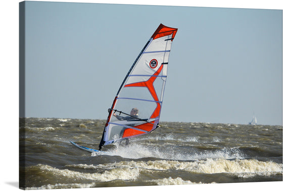 “Windsurf” captures the exhilarating dance between man and nature—a windsurfer navigating the tumultuous waves with grace and agility. The vibrant sail, a fiery orange against the azure sea, propels the surfer forward. Each splash of ocean mist, every curve of the board, tells a story of freedom and adventure.