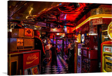  Step into the electrifying atmosphere of our “Gaming Arcade” print, where nostalgia and excitement merge in a visual symphony of color and light. Every corner is adorned with iconic brands and memorabilia, igniting the thrill of yesteryears. The checkered floor, bathed in the neon glow, guides you through an eclectic mix of classic arcade games and vintage décor. 