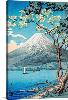  “Mount Fuji from Lake Yamanaka” is a mesmerizing artwork that captures the serene beauty of nature in its most pristine form. The iconic Mount Fuji, adorned with a snowy cap, stands majestically against the azure sky, casting its reflection on the tranquil waters of Lake Yamanaka. A lone fisherman in his boat and distant sails add a touch of life to this picturesque scene. 