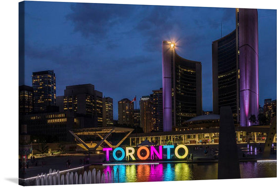 This captivating print captures the enchanting allure of Toronto’s cityscape at dusk. The radiant glow of the iconic “TORONTO” sign, reflected in the serene waters below, serves as a beacon of vibrant energy and boundless possibilities. The meticulously crafted details of the illuminated architectural marvels standing tall against the twilight sky transport you to this magnificent metropolis.