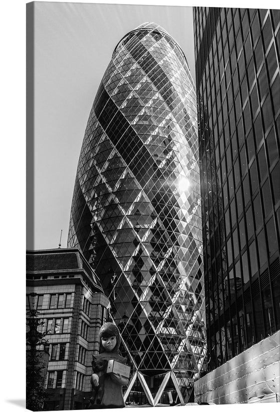 “The Gherkin” is a captivating glimpse into the architectural splendor of London. This exquisite print features the iconic 30 St Mary Axe, affectionately known as “The Gherkin” due to its distinctive shape. Against the cityscape, this neo-futuristic skyscraper stands tall, its intricate geometric design reflecting the dynamic pulse of England’s capital. 