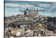  “Toledo, Spain” invites you to immerse yourself in the enchanting allure of this ancient city. Captured by artist Greta Scholderle Moller, this exquisite print transports you to the heart of Toledo, where time stands still. The iconic Alcázar of Toledo stands majestically against a sky that shifts from warm gold to cool blue. 