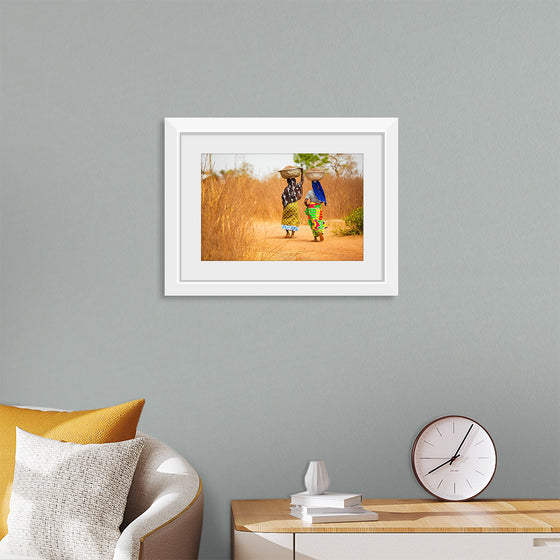 "Women in West Africa Village Carrying Baskets Filled With Shea Butter Fruits"