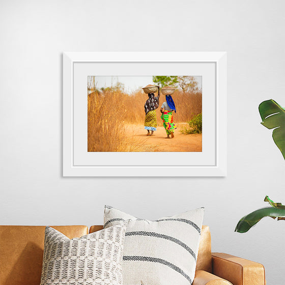 "Women in West Africa Village Carrying Baskets Filled With Shea Butter Fruits"