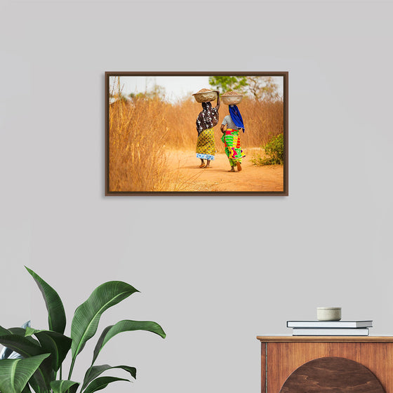 "Women in West Africa Village Carrying Baskets Filled With Shea Butter Fruits"