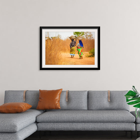 "Women in West Africa Village Carrying Baskets Filled With Shea Butter Fruits"