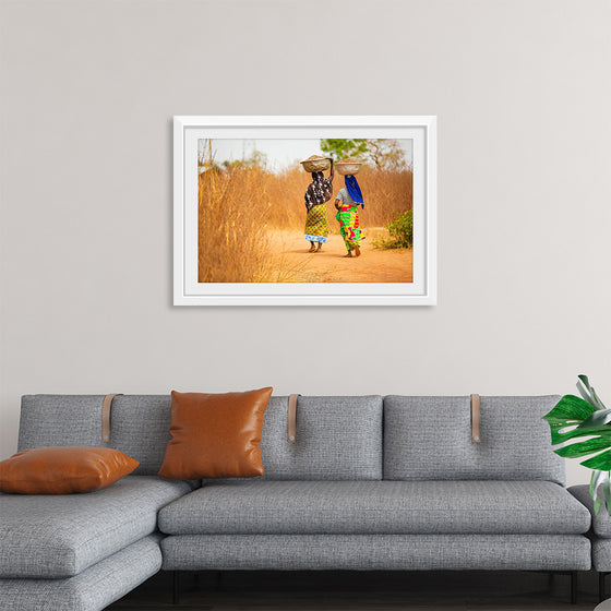 "Women in West Africa Village Carrying Baskets Filled With Shea Butter Fruits"