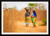 "Women in West Africa Village Carrying Baskets Filled With Shea Butter Fruits"