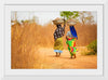 "Women in West Africa Village Carrying Baskets Filled With Shea Butter Fruits"