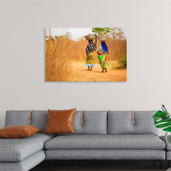 "Women in West Africa Village Carrying Baskets Filled With Shea Butter Fruits"