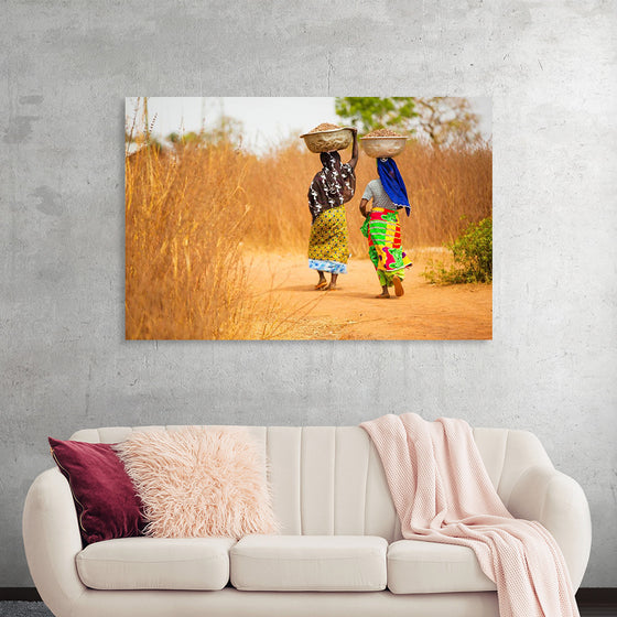 "Women in West Africa Village Carrying Baskets Filled With Shea Butter Fruits"