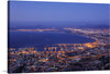 “Cape Town Top View at Night” is a stunning print that captures the beauty of the city from above. The vibrant colors and intricate details make this print a perfect addition to any home or office. The image is taken from a high vantage point, looking down on the city.