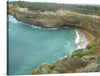 “Secluded Bay on the Great Ocean Road” by Smegs07 invites you to a hidden gem along Australia’s iconic coastal route. Here, azure waters gently kiss the golden sands of a secluded beach, nestled against majestic cliffs. The lush greenery crowning the cliffs adds vibrancy to their rugged beauty. 