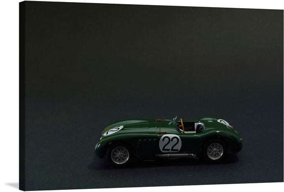 Immerse yourself in the world of classic racing with this exquisite print. The artwork features a meticulously detailed model of a green racing car, marked with the iconic “22”. Set against a dark backdrop, every curve and contour is accentuated, evoking the thrilling atmosphere of historic races. 