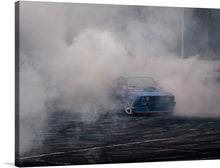  “BMW Burnout” is an adrenaline-fueled masterpiece that captures the raw power and precision of speed. In this stunning print, a blue BMW defies gravity, its tires screeching as it performs a dynamic burnout. The smoke billows around the car, frozen in a moment of sheer intensity. Against a serene grey backdrop, the vibrant blue hue of the car stands out, accentuating its majestic stance amidst chaos. 