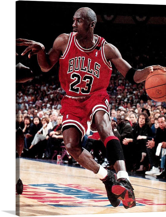 “Jordan elgrafico 1992” is an iconic print that captures the essence of basketball greatness. The artwork features a dynamic pose of one of basketball’s greatest players, Michael Jordan, in mid-action during a game. He is wearing a red Chicago Bulls jersey with the number 23 visible and dribbling an orange basketball. The court floor has visible markings including part of what appears to be the NBA logo. 