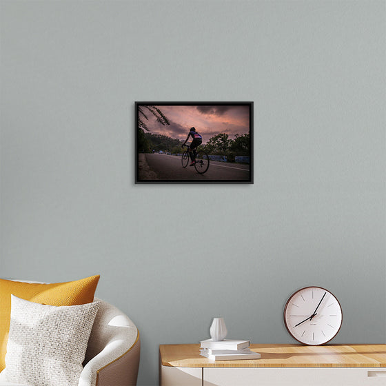 "Male bicycling along a treed road in Ooty"