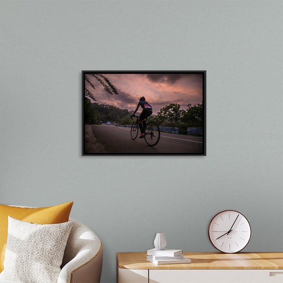 "Male bicycling along a treed road in Ooty"