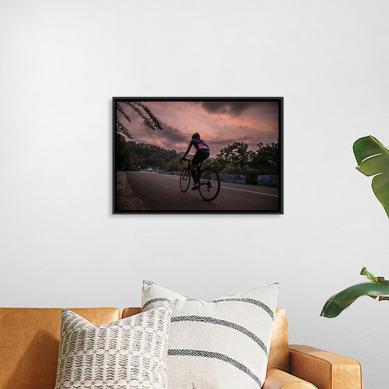 "Male bicycling along a treed road in Ooty"