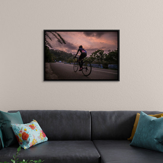 "Male bicycling along a treed road in Ooty"