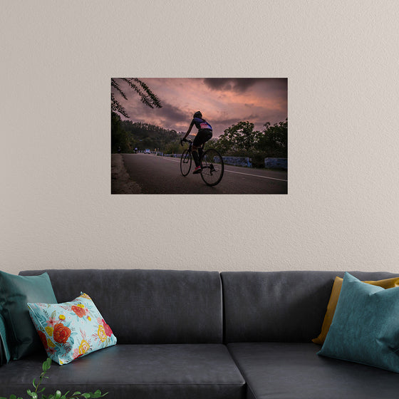 "Male bicycling along a treed road in Ooty"