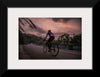 "Male bicycling along a treed road in Ooty"