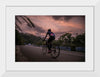 "Male bicycling along a treed road in Ooty"