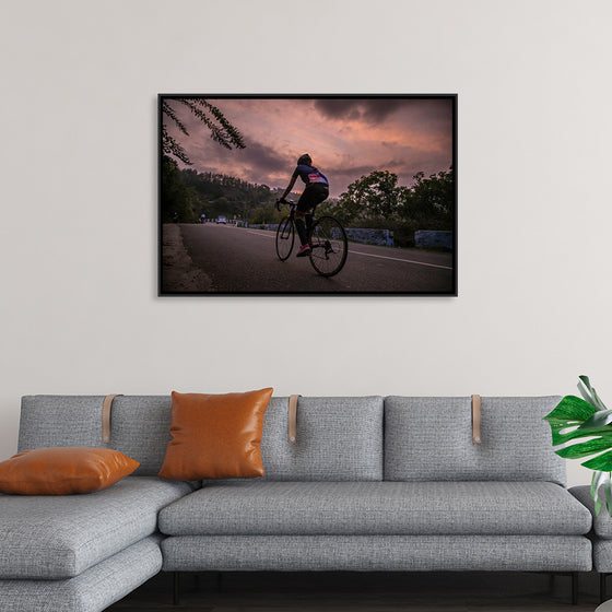 "Male bicycling along a treed road in Ooty"